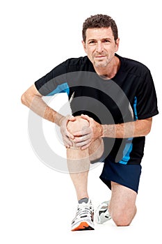 Adult attractive man in sportswear knee pain injury ache isolated