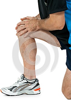 Adult attractive man in sportswear knee pain injury ache isolated