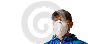 An adult male worker is wearing an N95 respirator mask and looking into the camera lens. photo