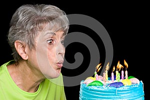 Adult blowing out candles
