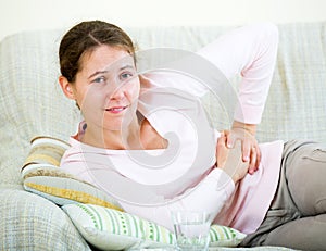 Adult brunette having abdominal pains