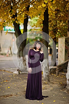 Adult brunette woman at violet gown