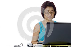 Adult business woman working at her computer
