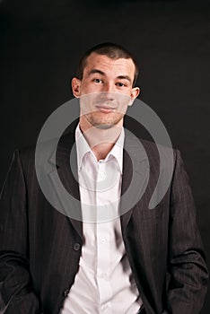 Adult businessman on a black background