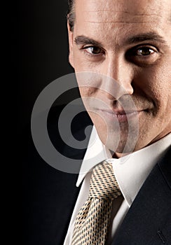 Adult businessman close-up portrait smiling