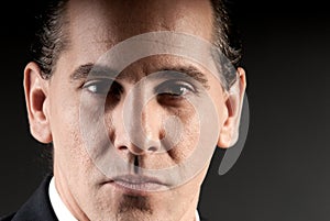 Adult businessman closeup portrait on dark