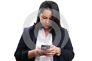 Adult businesswoman looking at phone while sending text message