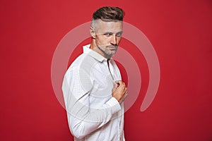 Adult caucasian man 30s with stubble in white shirt looking on c