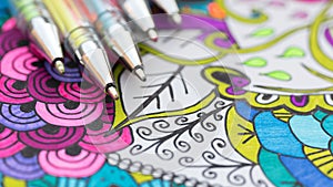 Adult coloring book, new stress relieving trend. Art therapy, mental health, creativity and mindfulness concept.