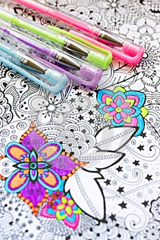 Adult coloring book, new stress relieving trend. Art therapy, mental health, creativity and mindfulness concept. Adult coloring.