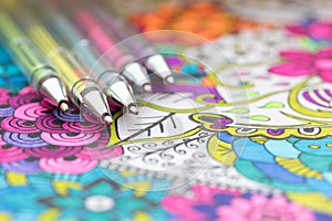 Adult coloring book, new stress relieving trend. Art therapy, mental health, creativity and mindfulness concept.