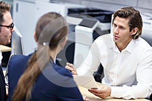 Adult couple in the office with real estate agent