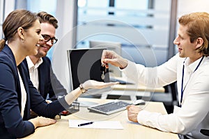 Adult couple in the office with real estate agent