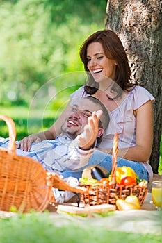 Adult couple picnicking