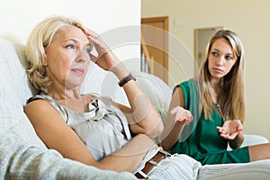 Adult daughter and mature mother having conflict