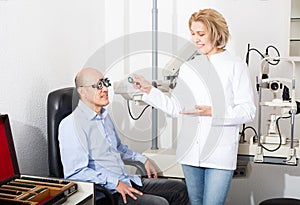 Adult doctor examinating eyesight