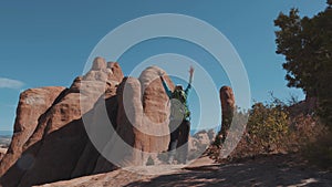 Adult Female Backpacker Hiking In Arches National Park In Utah