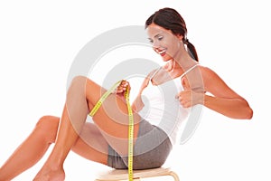 Adult female on diet measuring body shape