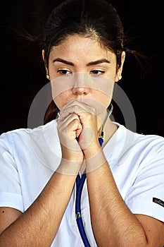 Adult Female Nurse And Depression Wearing Scrubs