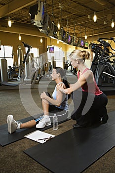 Adult female with personal trainer.