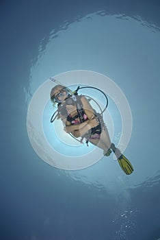 Adult Female scuba diver in bikini photo