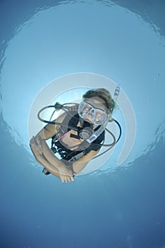 Adult Female scuba diver in bikini photo