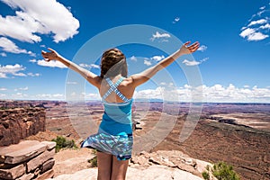 Adult female takes in the scenic view on a breezy day in Canyonlands National Park - Island in the Sky area photo