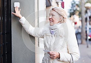 Adult female is walking and visiting friend in unknown city