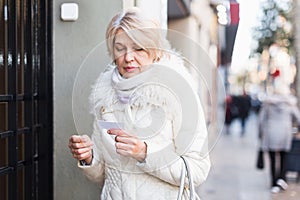 Adult female is walking and visiting friend in unknown city