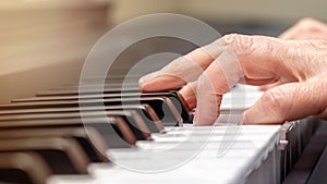 Adult Hand Practicing Playing Piano