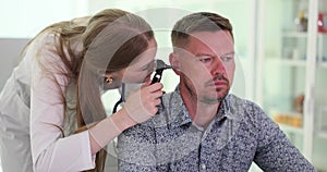 Adult hearing testing and otoscopy in clinic