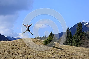 Adult hiker is jumping