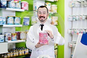 Adult male pharmacist suggesting useful drug