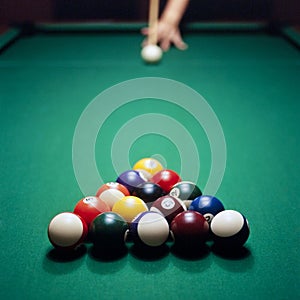 Adult male playing pool, snooker or billiard