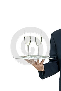 Adult male waiter serving two glass of champagne isolated