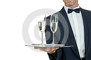 Adult male waiter serving two glass of champagne isolated