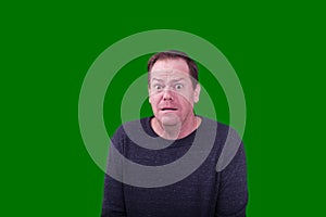 Adult man ashamed facial expression on green screen background