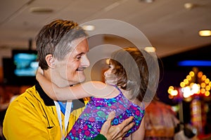 Adult Man With Downs Syndrome Holds His Great Niece Like They Ar photo
