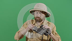 Adult Man Explorer Cleaning His Binoculars