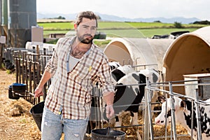 Adult man farmer working at farm