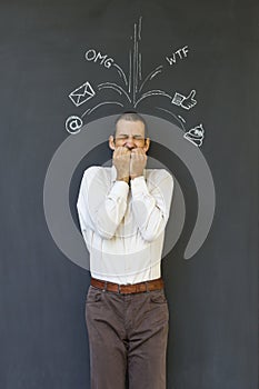 Adult man frustrated and stressed from social media overload photo