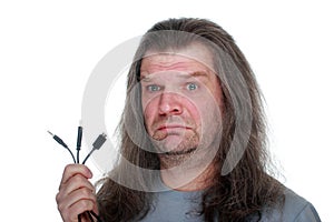 Adult man grieves with a wire.