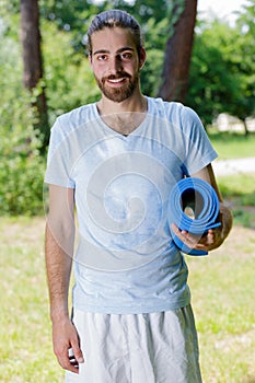 adult man after joga exercising outdoors