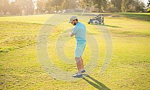 adult man playing golf game on green grass, sportsman