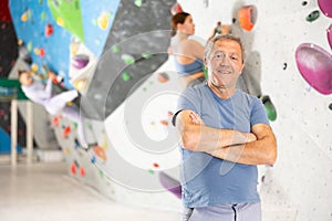 Adult man posing on climbing wall