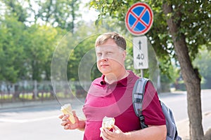 An adult man prone to fatness with two glasses photo