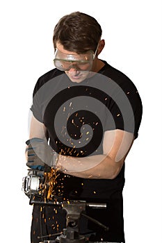 Adult man in protective mask cutting a metal saw with a Bulgarian tool isolated on white