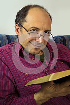 Adult man reading a bible