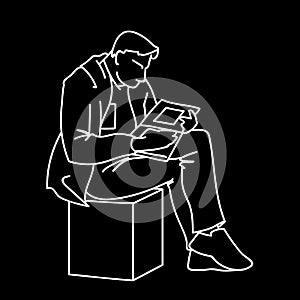 An adult man is reading a book sitting on a cube. Vector illustration of a man gazing intently into a magazine or