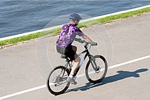 Adult man riding on mountain bicycle